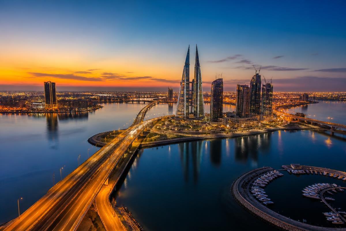 Bahrain cityscape and King Fahd Causeway at dusk